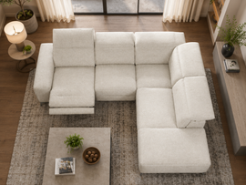 White sectional sofa in a living room with a coffee table and decor items.