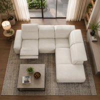 White sectional sofa in a living room with a coffee table and decor items.