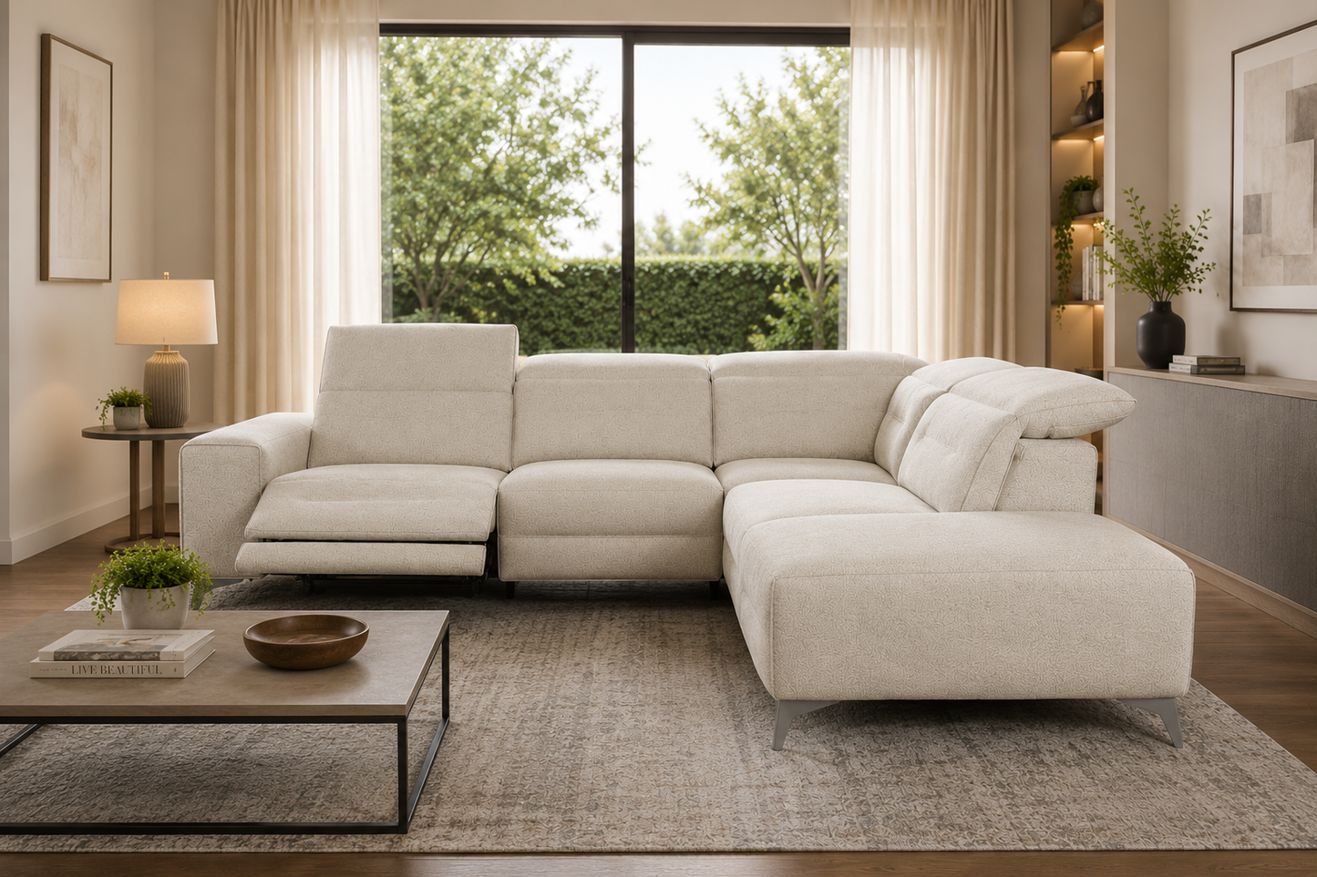 Modern living room with a beige sectional sofa, coffee table, and large windows.